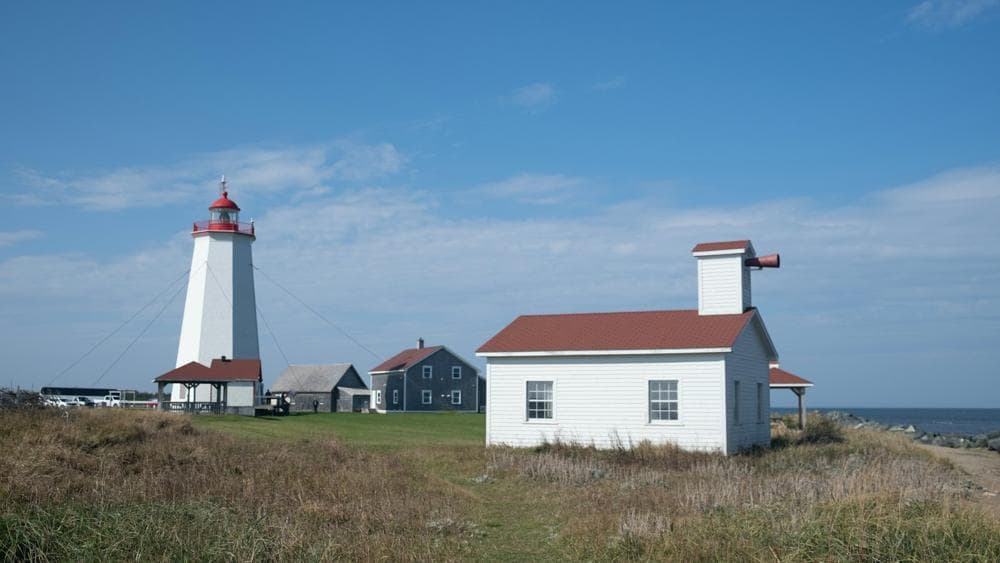 A lighthouse on the green coast of New Brunswick